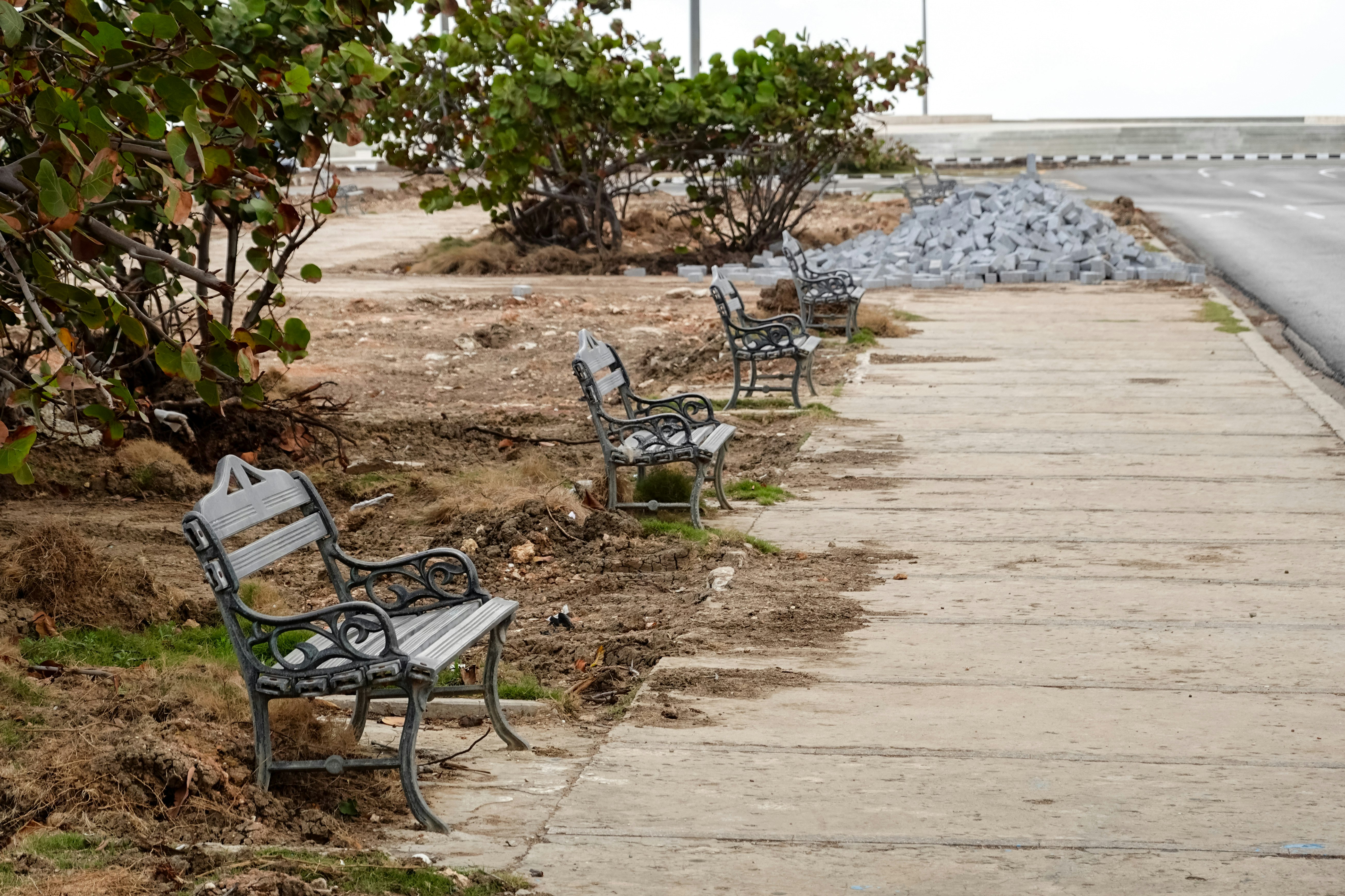 brown wooden bench on brown sand during daytime